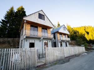 an old house with a fence in front of it at Gomarduli Inn გომარდული ინნ in Gomarduli