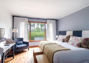 Postel nebo postele na pokoji v ubytování La Escondida Casa De Huespedes & Spa