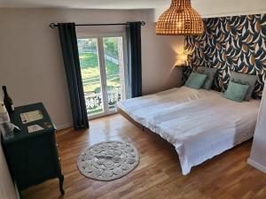 Postel nebo postele na pokoji v ubytování Manoir du Taillis