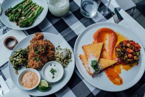 a table with plates of food on a table at 2 Zimmer Wohnung an der Isar in Munich