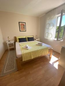 Łóżko lub łóżka w pokoju w obiekcie Apartment Tasha