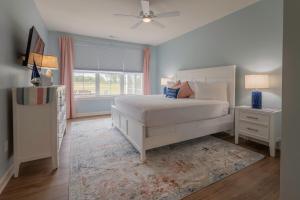 a bedroom with a white bed and a window at 2728 Harbor Court in Delavan