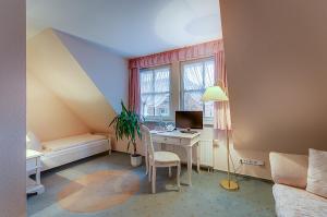 Ein Sitzbereich in der Unterkunft Hotel Zur Burg GmbH