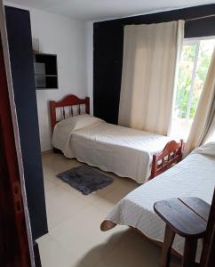 Ένα ή περισσότερα κρεβάτια σε δωμάτιο στο Mi casita en Embalse +5 φωτογραφίες