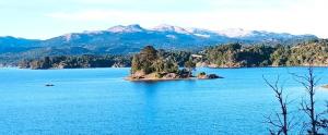 an island in the middle of a large body of water at Cabaña Rodar in Villa Pehuenia