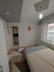 Postel nebo postele na pokoji v ubytování Zeytin Apart Daire 7