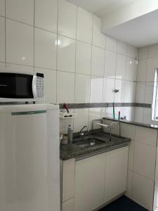 Kuchyň nebo kuchyňský kout v ubytování Aconchegante apartamento II
