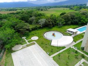 an overhead view of a swimming pool in a field at apto fontana campestre 3 habitaciones con parqueadero in Ibagué