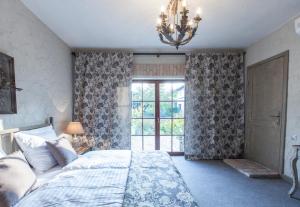 Łóżko lub łóżka w pokoju w obiekcie Apartamenty Za Murem