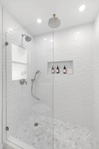 a shower with a glass door in a bathroom at Casa Bella Naples Vacation Home in Naples +43 photos