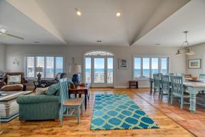a living room with a couch and a table at Large Family Beach Rental at Oceanfront. in West Onslow Beach