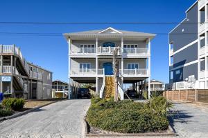 a large apartment building with a street in front at Large Family Beach Rental at Oceanfront. in West Onslow Beach