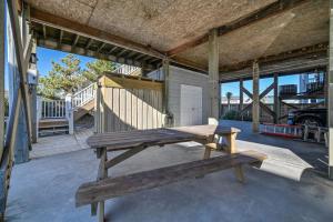 a bench on the porch of a house at Large Family Beach Rental at Oceanfront. in West Onslow Beach
