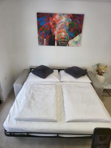 En eller flere senge i et værelse på Apartment Sarabi + 16 billeder