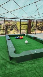 a group of balls sitting on the grass under a tent at La Villafranca del Cid in Zitácuaro