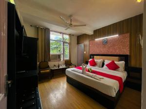 Postel nebo postele na pokoji v ubytování Hotel Redchilli