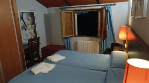 Postel nebo postele na pokoji v ubytování Dulce Posada