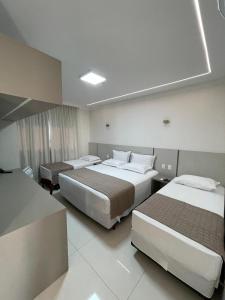 Cama ou camas em um quarto em Hotel Jardim
