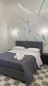 a bedroom with a large bed with two pillows at Maison Toledo 376 in Naples