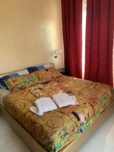 Posteľ alebo postele v izbe v ubytovaní National Gallery Taormina B&B