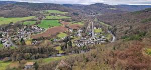 an aerial view of a village in the mountains at Panorama Eifel View in Nideggen