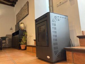 a television sitting on the floor in a room at Arcos de la Loba by casitasconencantoes in Medina Sidonia