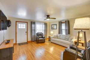 a living room with a couch and a chair at 4 Mi to Kentucky Downs Countryside House in Portland