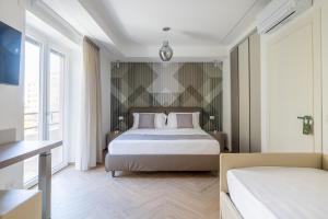 Postel nebo postele na pokoji v ubytování Hezio Guest House