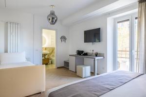 TV a/nebo společenská místnost v ubytování Hezio Guest House