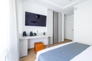 Postel nebo postele na pokoji v ubytování Hezio Guest House