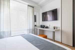 Postel nebo postele na pokoji v ubytování Hezio Guest House