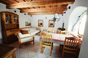 a kitchen and dining room with a table and chairs at Syparne in Liptovský Ján