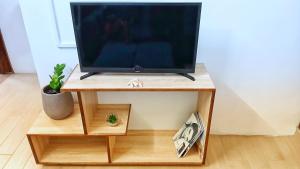 TV a/nebo společenská místnost v ubytování Villa Kiara