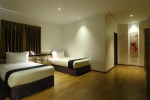 Katil atau katil-katil dalam bilik di K.C Hotel