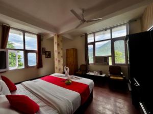 Postel nebo postele na pokoji v ubytování Hotel Redchilli