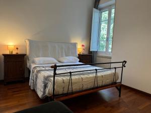 A bed or beds in a room at House Maximo at Colosseum