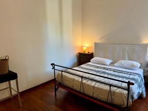 A bed or beds in a room at House Maximo at Colosseum