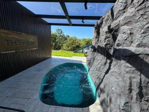 a jacuzzi tub in a rock wall at The View Villas in Ferizaj +7 photos