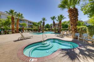 a swimming pool in the middle of a courtyard with palm trees at Las Palmas Condo with Pool Access in St George! in St. George