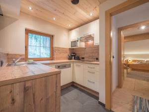 a kitchen with a sink and a counter top at Pension Sonderbichlhof in Pankrazberg