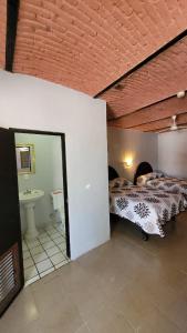 Postel nebo postele na pokoji v ubytování Hotel Amecatl