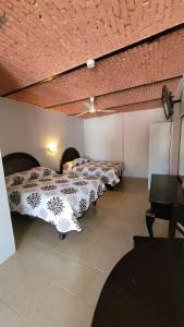 Postel nebo postele na pokoji v ubytování Hotel Amecatl