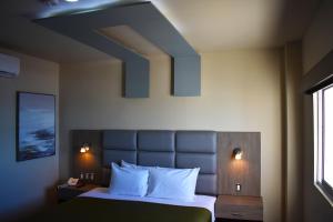 Postel nebo postele na pokoji v ubytování Hotel Jatay