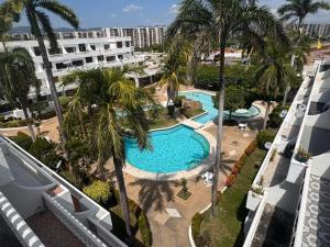 Bazén v ubytování Apartamento Tiziano Resort nebo v jeho okolí