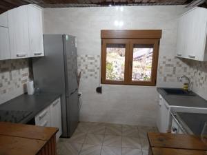 Kuchyň nebo kuchyňský kout v ubytování House under peaks + 37 fotografií