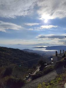 a view of the ocean from a hill at Δωμάτια με Θέα in Volos