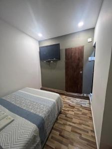 Postel nebo postele na pokoji v ubytování Hostal la muralla getsemani + 20 fotografií