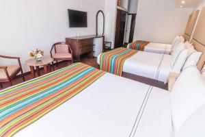 Кровать или кровати в номере Sonesta Posadas del Inca Puno