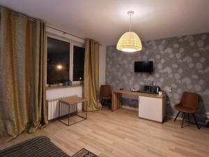 Μια τηλεόραση ή/και κέντρο ψυχαγωγίας στο Mini Hotel on Demiivska