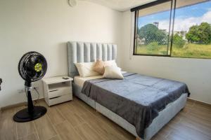 Postel nebo postele na pokoji v ubytování 1007 Nuevo Cerca Clinica Foscal & Ardila Lulle